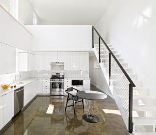 kitchen with mezzanine above at Hem House by Future Firm In Chicago