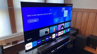The LG C3 OLED TV displaying a blue home screen.
