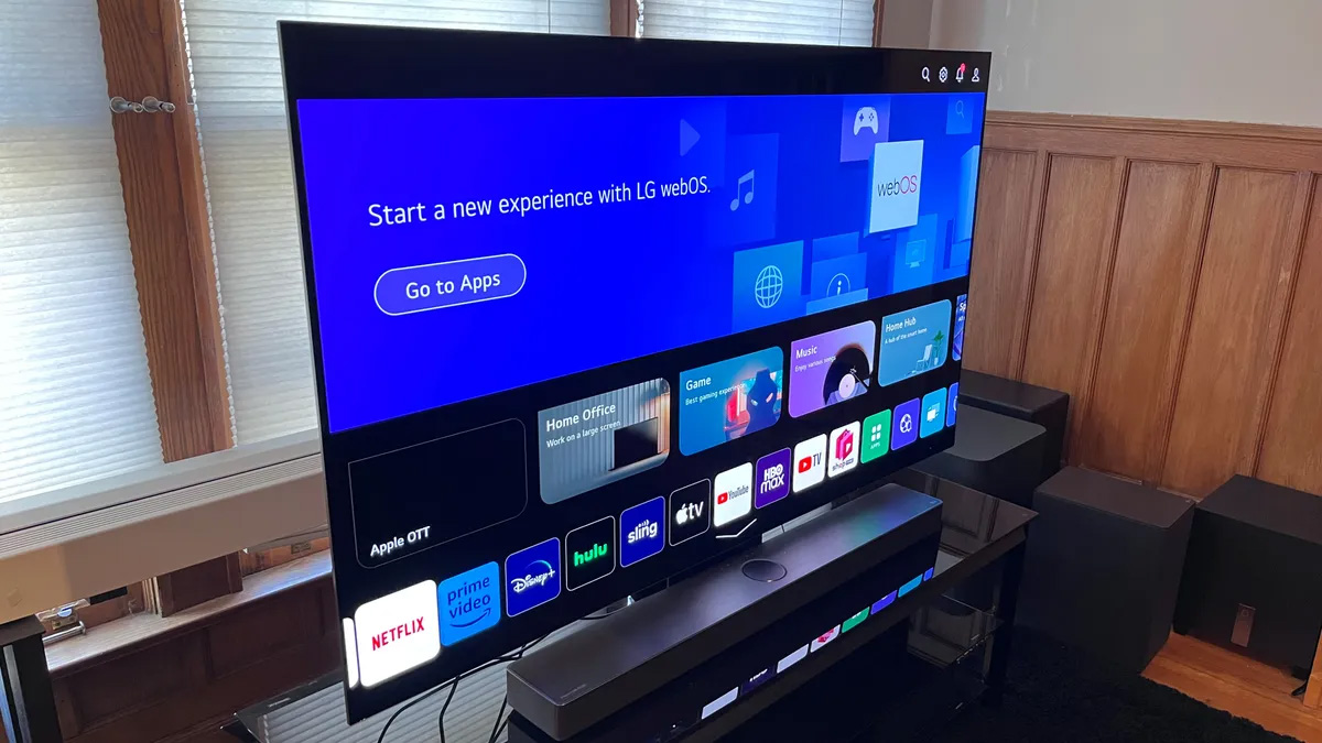 LG C3 OLED TV displaying a blue home screen.