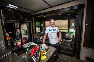 Horner stands in the kitchen of his RV.
