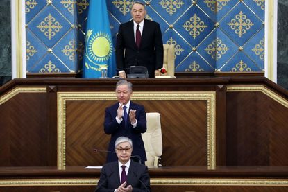 Kazakhstan's new president (bottom) and old president (top) at inauguration