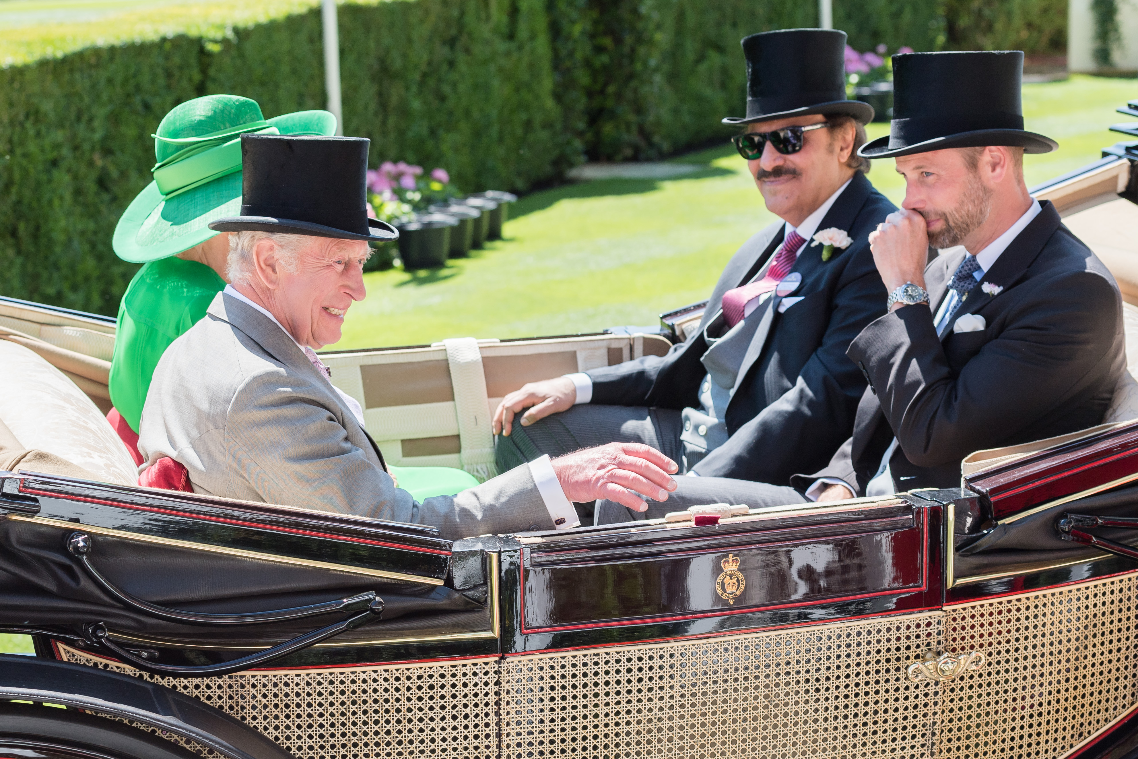 King Charles, Prince William and Queen Camilla riding in a carriage at Royal Ascot