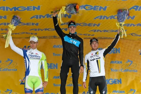 Ben Swift stands atop of the stage 2 podium with Peter Sagan (left) and Matt Goss (right).