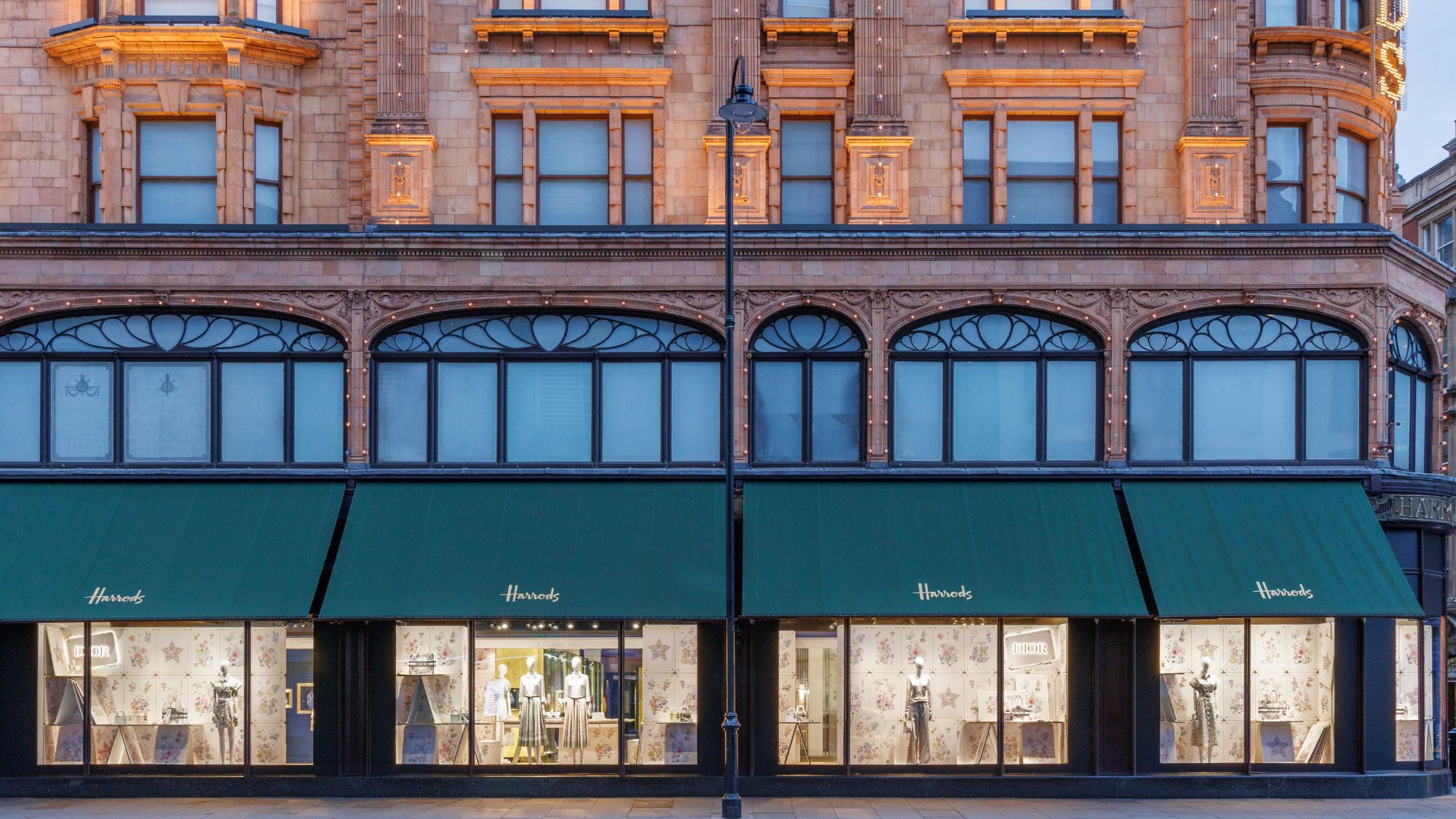 the exterior of harrods with dior lucky windows