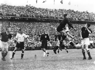 West Germany take on Hungary in the 1954 World Cup final at Bern's Wankdorf Stadium.