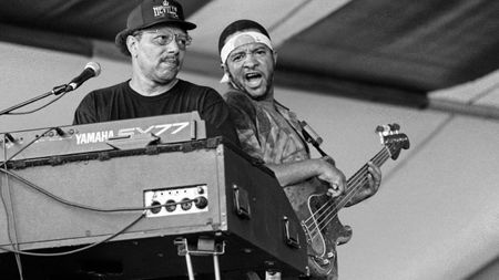 Art Neville (L) and George Porter, Jr (R) performing with the Funky Meters at the New Orleans Jazz & Heritage Festival on May 5, 1995.