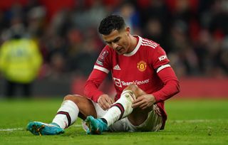 Manchester United’s Cristiano Ronaldo pulls his socks up during the Emirates FA Cup fourth round match at Old Trafford, Manchester. Picture date: Friday February 4, 2022