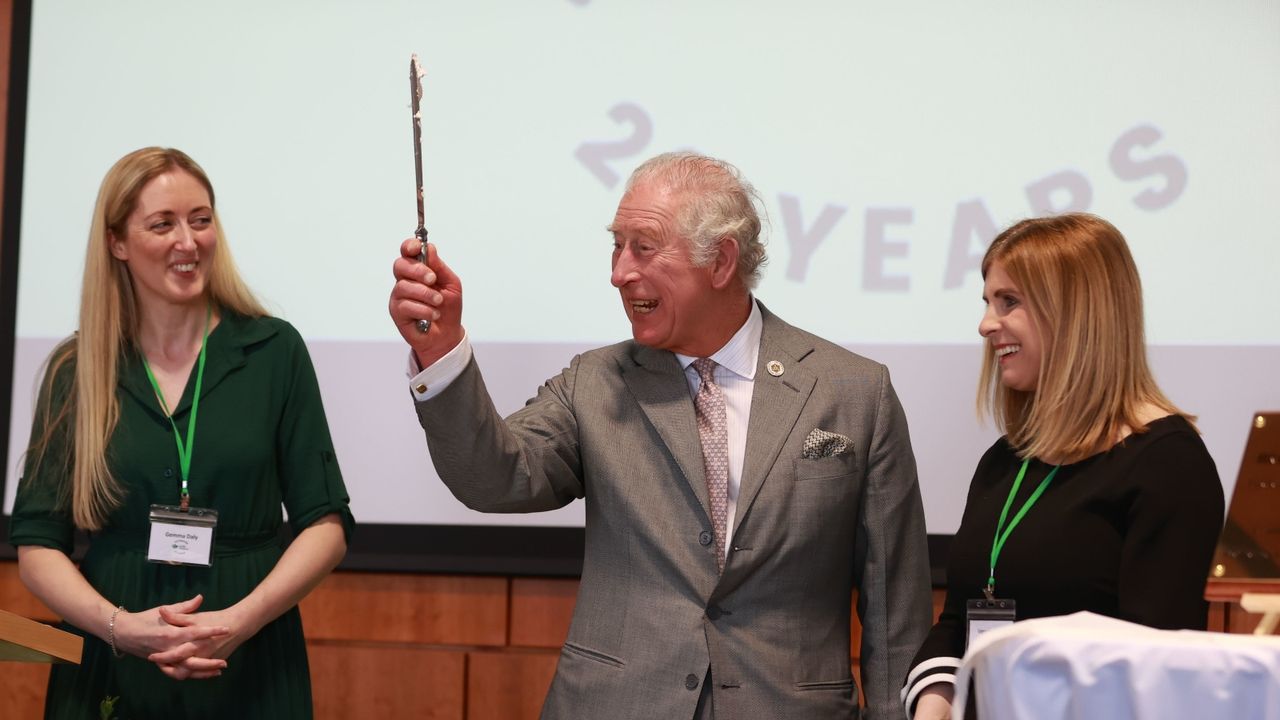  Prince Charles cake— Prince of Wales cuts a cake celebrating Rural Support Northern Ireland&#039;s 20th Anniversary during a visit to the College of Agriculture Food and Rural Enterprise on March 22, 2022 in in Cookstown in County Tyrone, Northern Ireland. Their Royal Highnesses are on the first day of a two day visit to the province. 