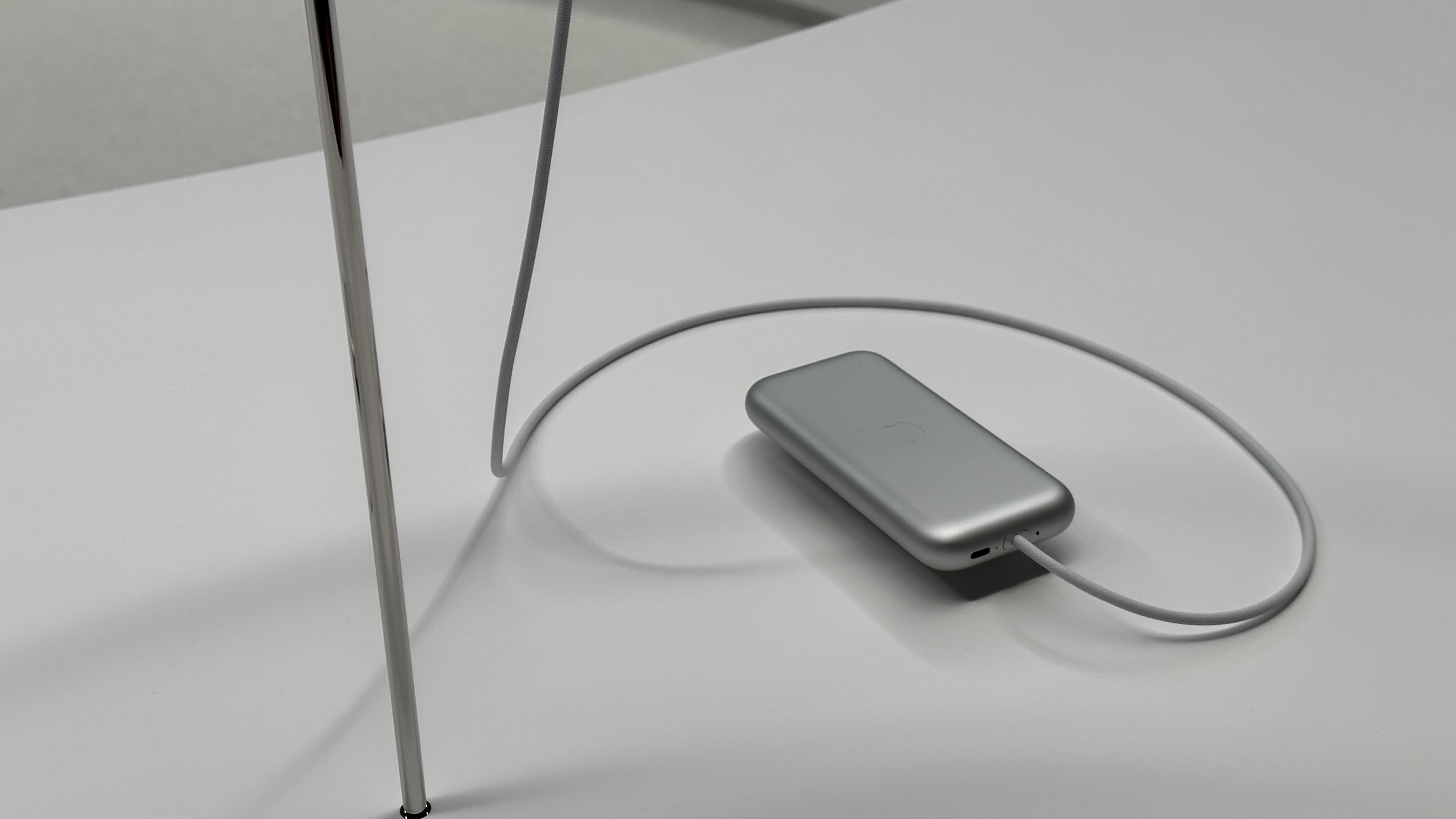 Apple Vision Pro VR headset's battery pack on a table