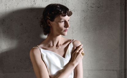 Model wearing Georg Jensen Moonlight Grapes gold jewellery