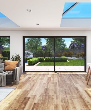 A 3D render of the interior of a large kitchen extension showing a large sliding door with views to a landscaped garden