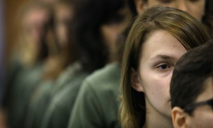 Female Marine recruits wait for a dental examination on their first full day of boot camp in February in South Carolina.