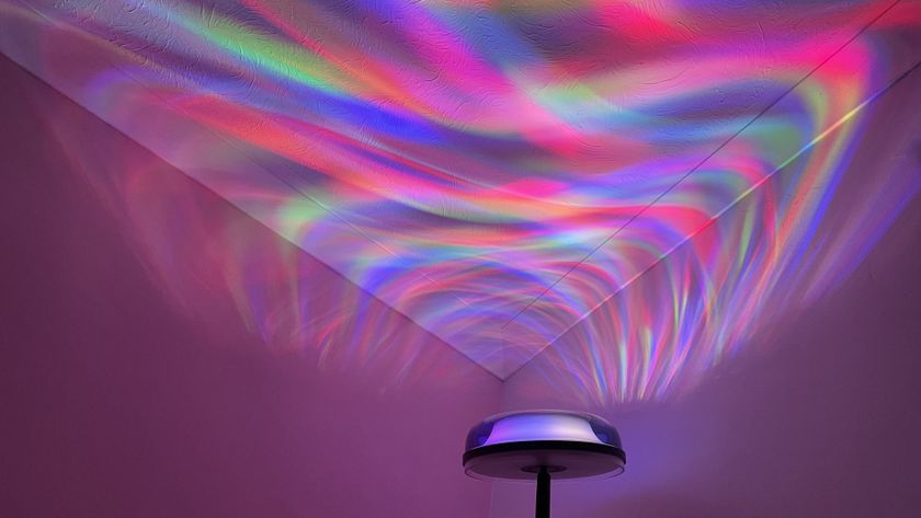 The Govee Uplighter Floor Lamp is in a corner, projecting an aurora borealis effect onto the ceiling.