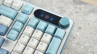 A Royal Kludge S98 wireless mechanical keyboard with blue, teal and white double-shot ABS keycaps