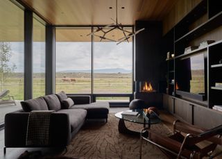 Living space with fireplace inside Black Fox Ranch, CLB Architects