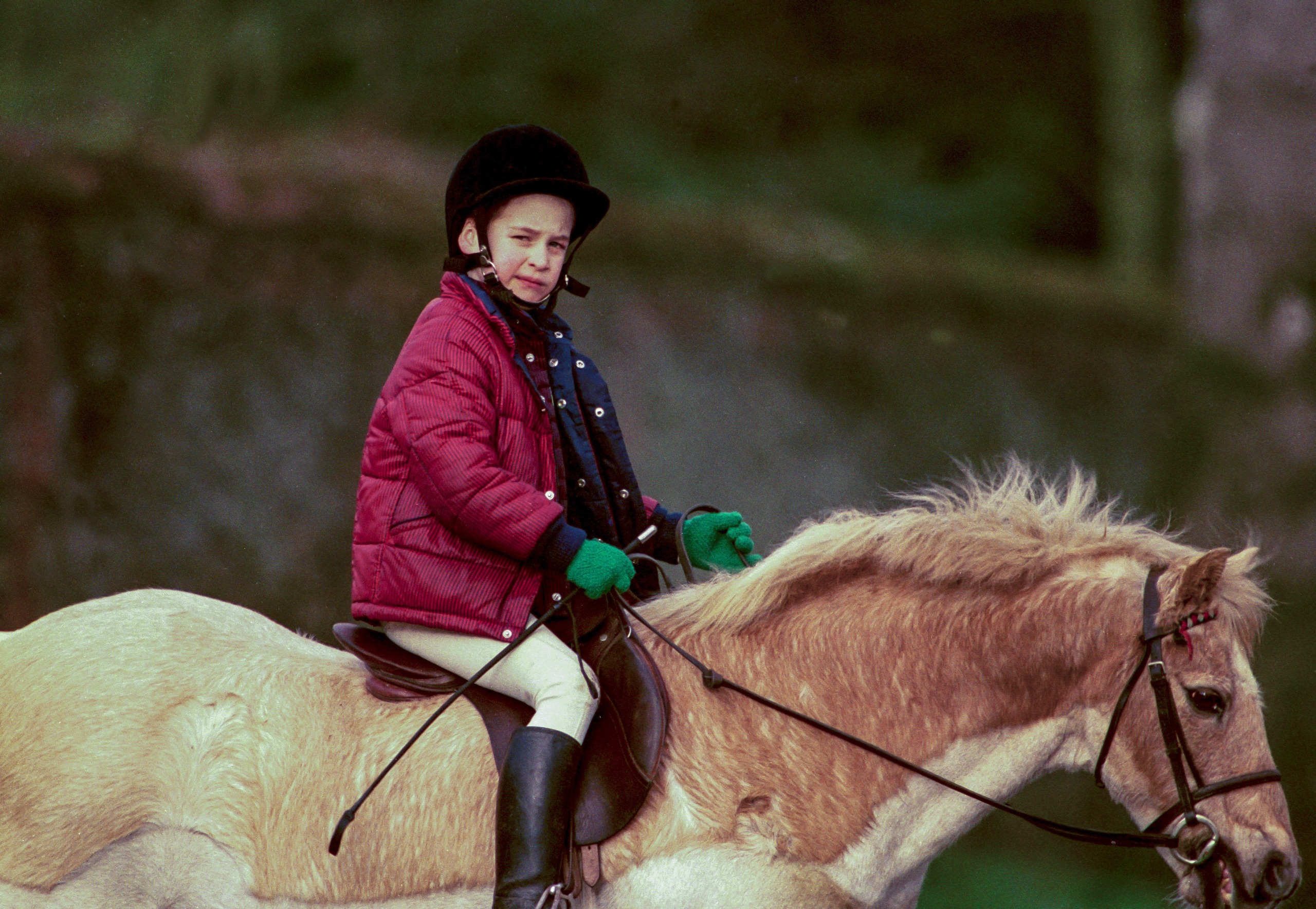 Prince William riding a horse on the Sandringham estate in 1990