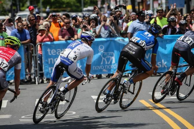 Fans watch as the break hits the bottom of the wall