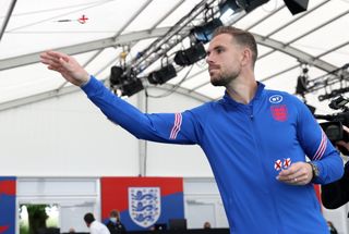 England’s Jordan Henderson plays darts after a press conference at St George’s Park