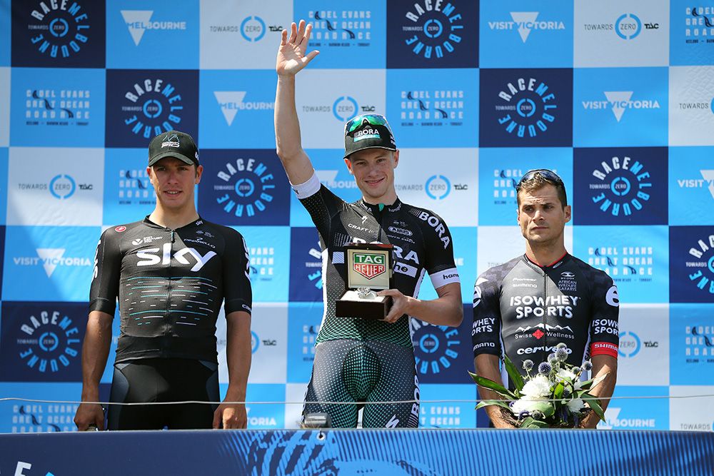 Sam Bennett waves from the top step of the podium