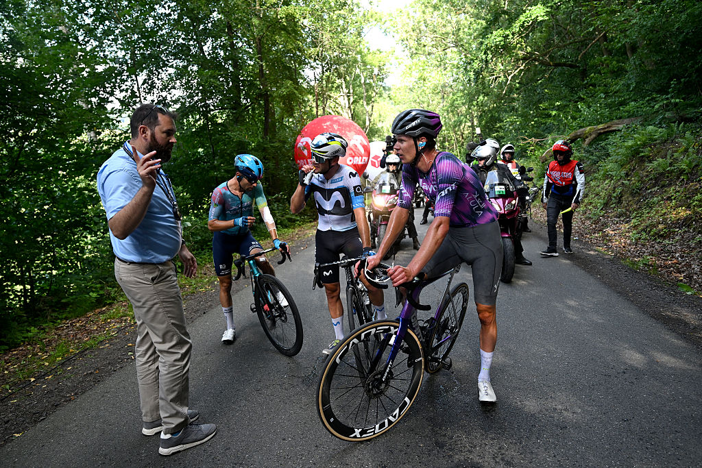 WALBRZYCH, POLAND - AUGUST 06: Lorenzo Milesi of Italy and Team Movistar, Kelland O'Brien of Australia and Team Jayco AlUla and Diego Ulissi of Italy and Team XDS Astana in the breakaway stopped due to the crash in the peloton during the 82nd Tour de Pologne 2025, Stage 3 a 159.3km stage from Walbrzych to Walbrzych / #UCIWT / on August 06, 2025 in Walbrzych, Poland. (Photo by Luc Claessen/Getty Images)