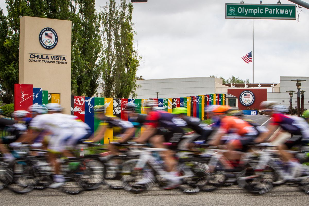 The peloton passes by the Olympic Training Center