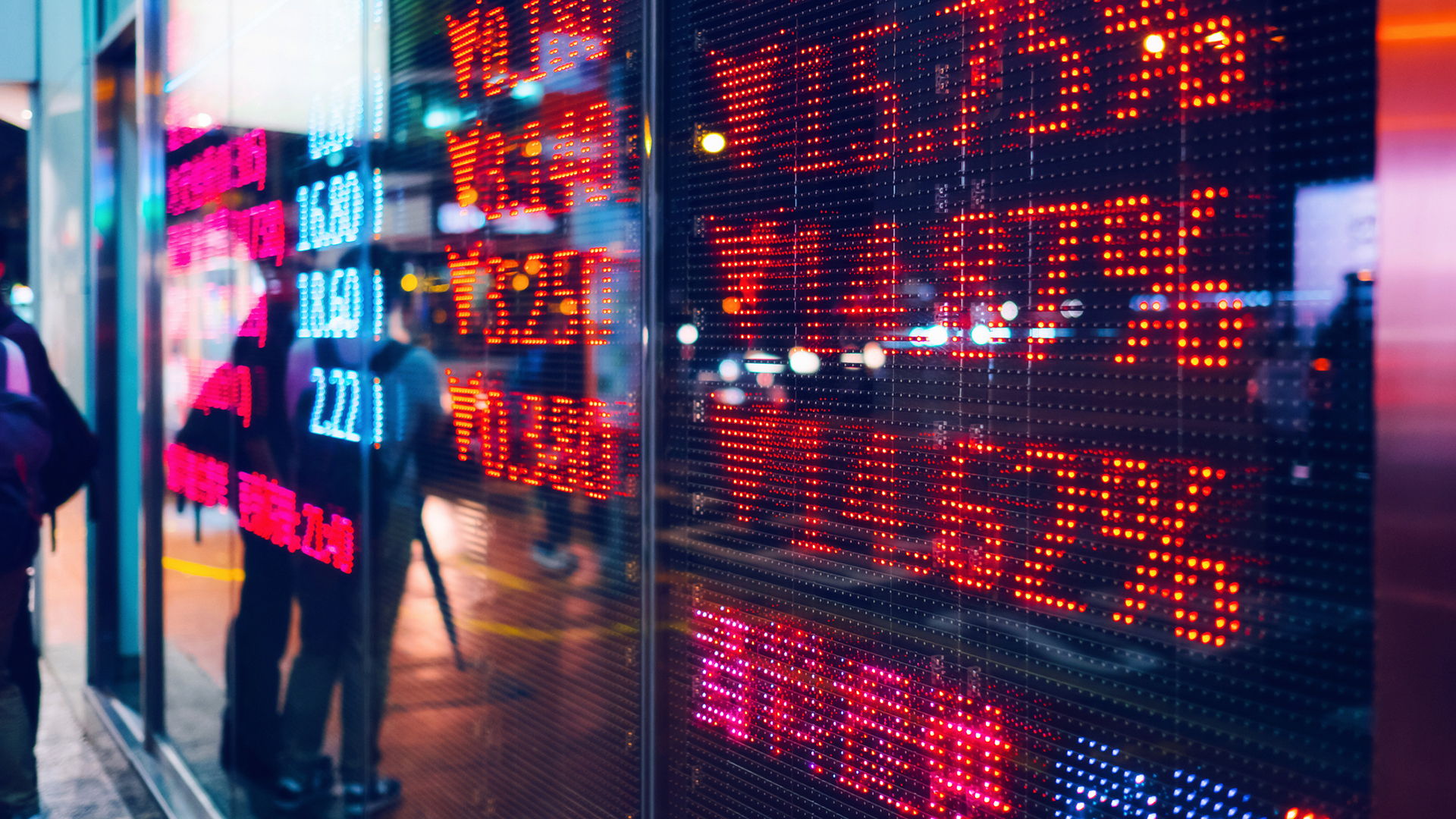 Stock exchange market display screen board on the street showing stock market crash sell-off in red colour