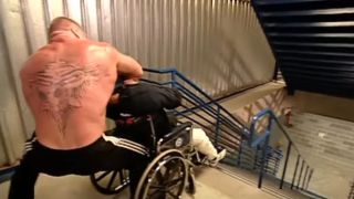 Brock Lesnar pushing Zach Gowen down the stairs