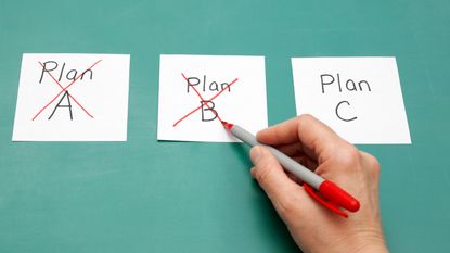 A person crosses out notes that read Plan A and Plan B in favor of Plan C.