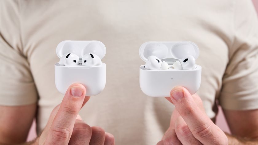 The open cases for AirPods Pro 2 and AirPods 4 held next to each other, showing the tops of the earbuds poking out
