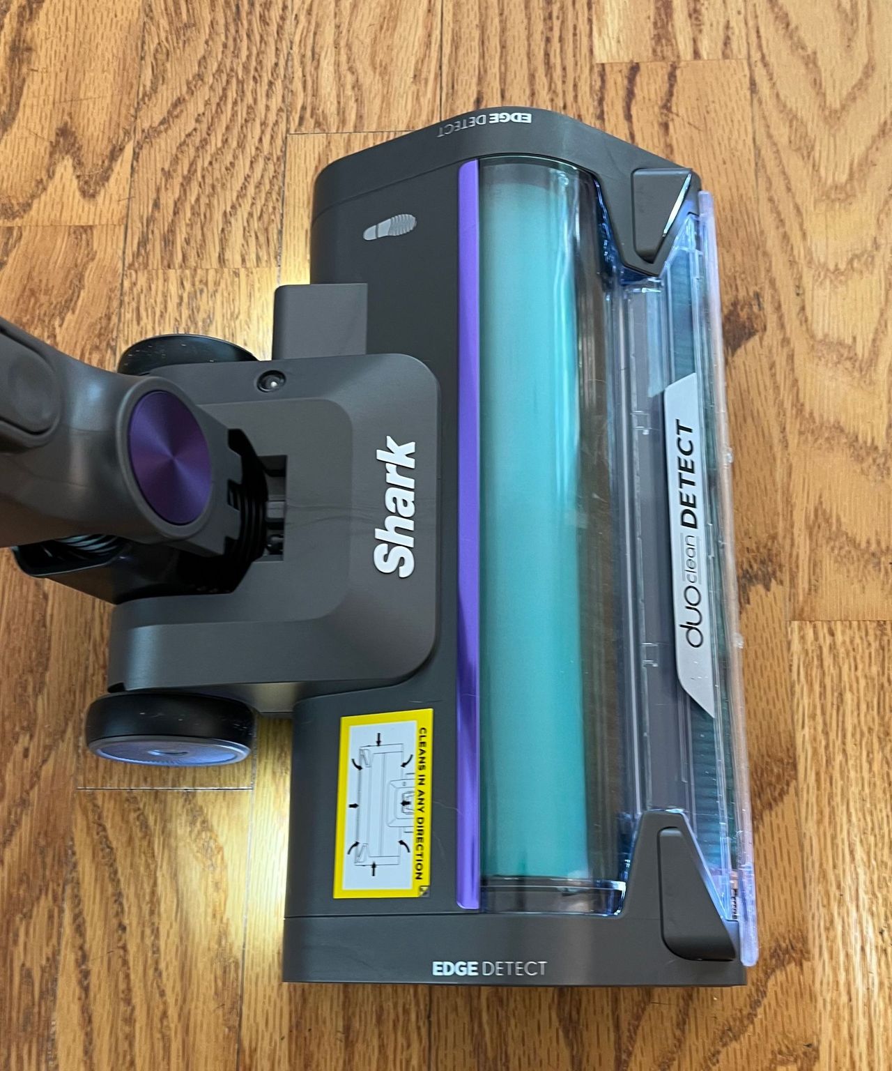 The main floorhead of the Shark Cordless PowerDetect on a wooden floor during testing at James' home