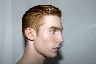side profile head shot of male model