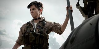 Tig Notaro staring into the distance while standing on her helicopter in Army of the Dead.