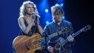Taylor Swift and Johnny Rzeznik of the Goo Goo Dolls perform during the "Speak Now World Tour" at Madison Square Garden on November 21, 2011 in New York City.