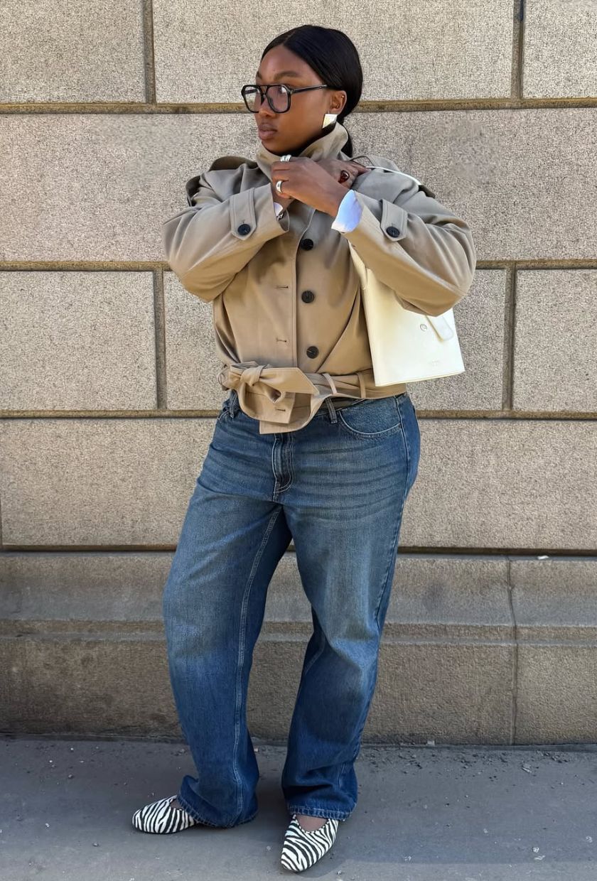 @nnennaechem wears a cropped trench, straight jeans and zebra ballet flats