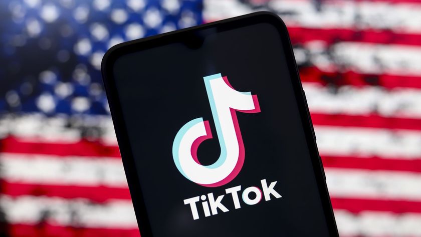 The TikTok logo appears on a smartphone screen with the United States flag in the background