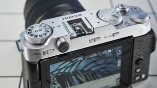 A Fujifilm X-M5 mirrorless vlogging camera in the silver colorway