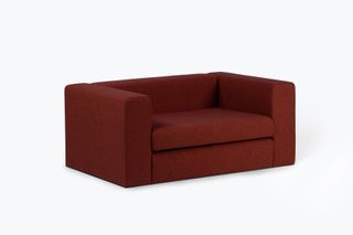 Red two seater sofa by Cini Boeri