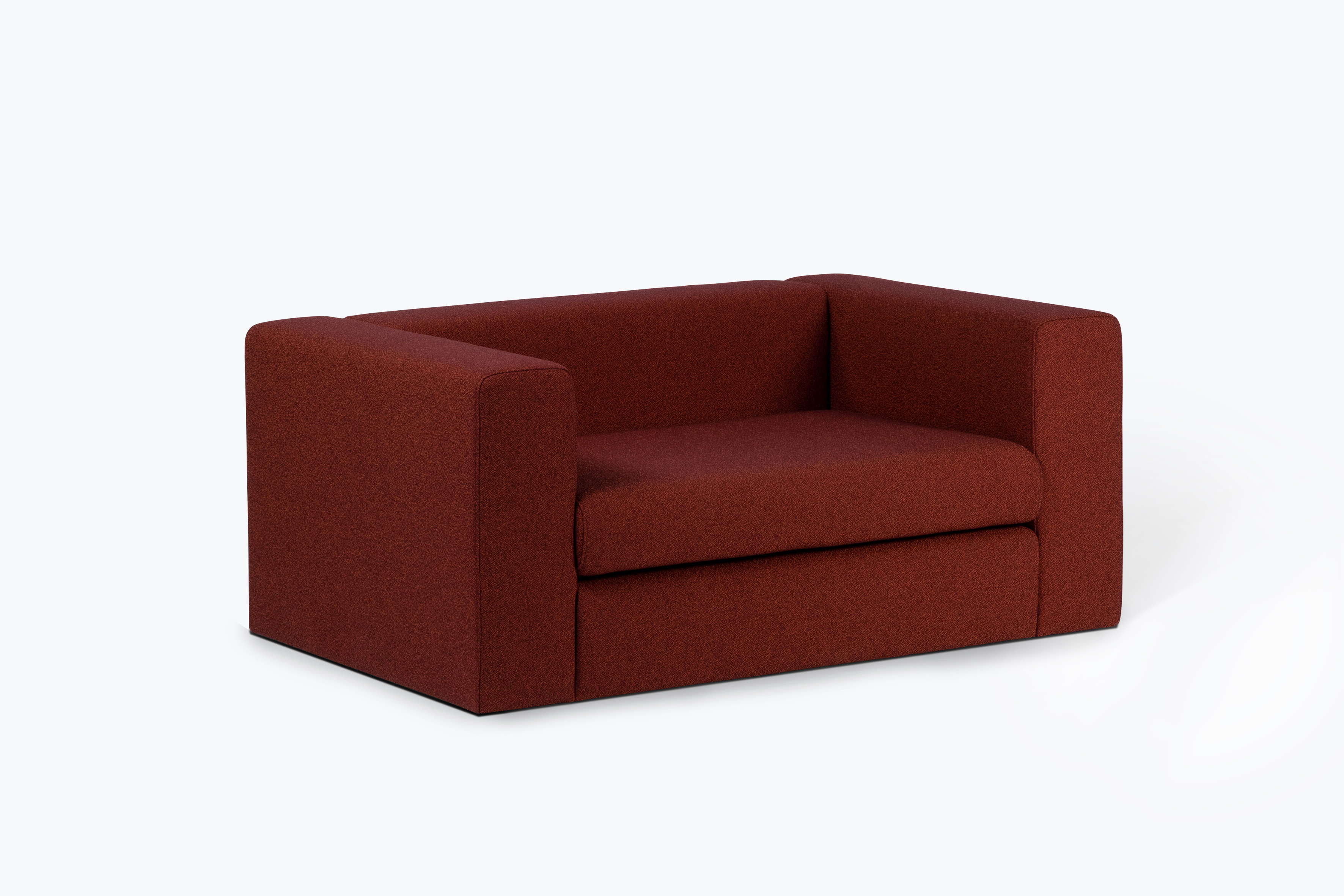 Red two seater sofa by Cini Boeri