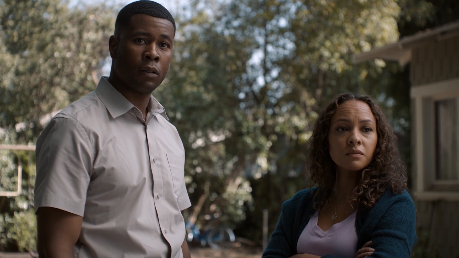 John Stewart Sr and Bernadette looking at an off-camera John Stewart Jr in Lanterns episode 3