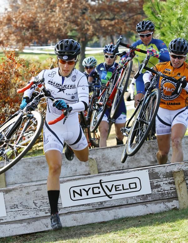 Arley Kemmerer (C3 - Athletes Serving Athletes) leads the women through the first set of barriers.