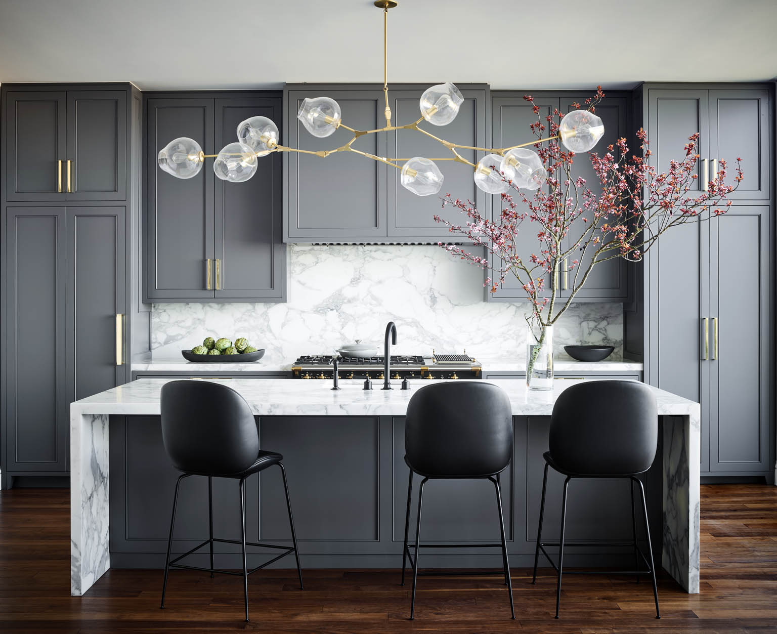 A kitchen bathed in shades of mid-tone gray
