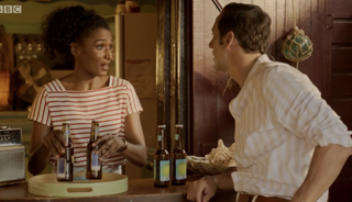 Camille serving driving at Catherine's Bar in Death in Paradise season 10 episode 6