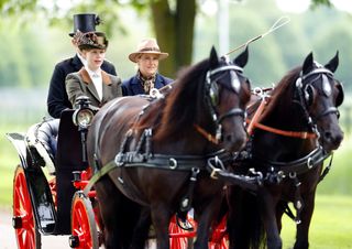 Lady Louise and the Duchess of Edinburgh driving a carriage