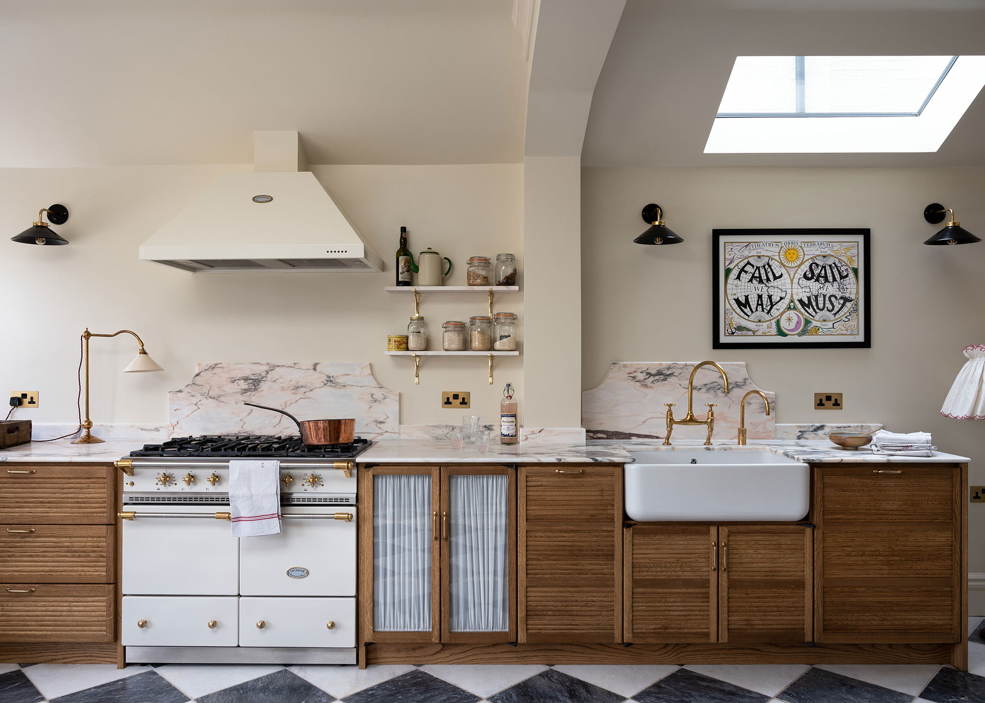 wooden kitchen with black and white flooring and marble countertops with decorative upstands