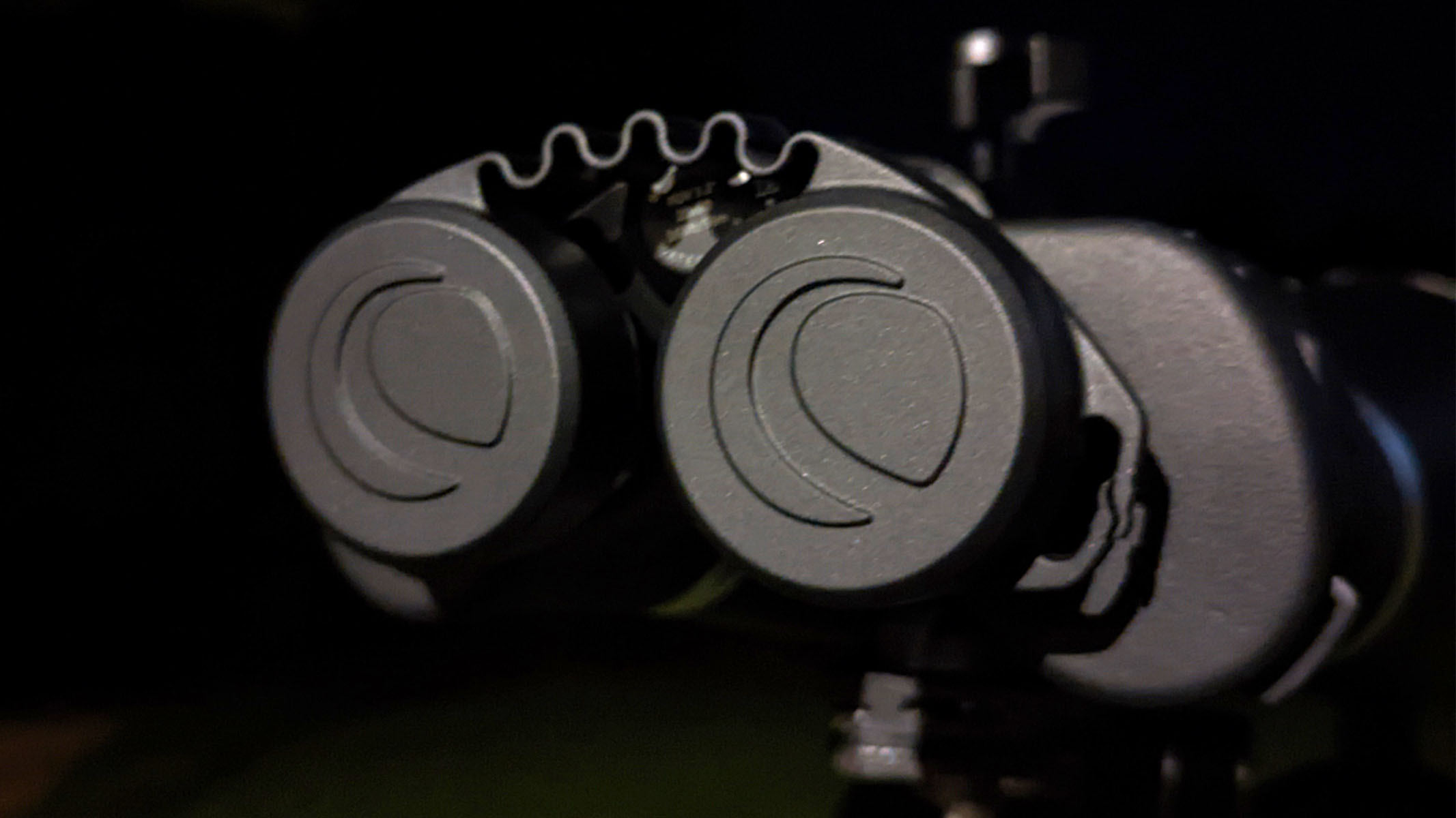 Eyepiece lens caps on the binoculars at night