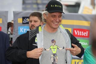 Tinkoff team owner Oleg Tinkov points to his Peter Sagan shirt after his rider won stage 2 and took the yellow jersey