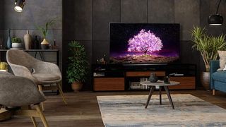A product image of the LG C1 TV on a unit in a cosy living area