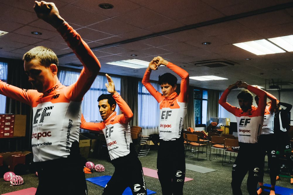 The EF Education First-Drapac do some stretching before their ride
