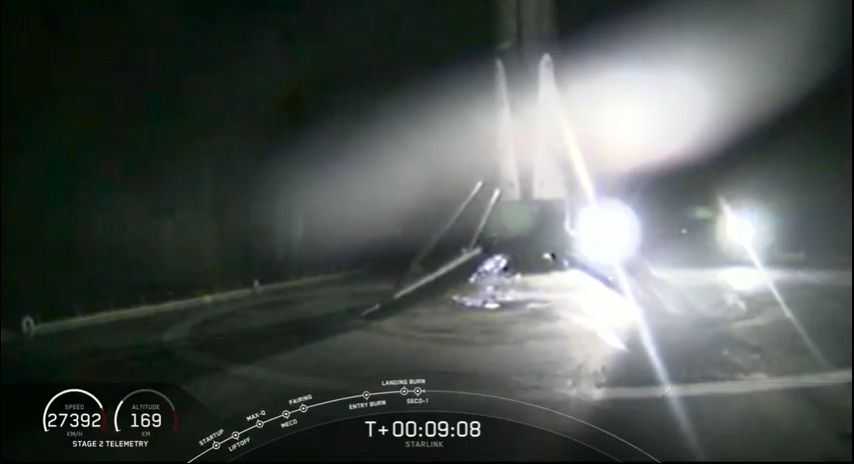 A SpaceX Falcon 9 rocket stands atop the drone ship Of Course I Still Love You in the Atlantic Ocean after a successful landing following the launch of 60 Starlink satellites on May 23, 2019. It was the third flight for this booster.