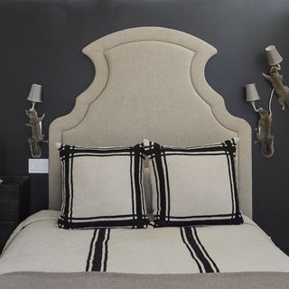 black bedroom with beige